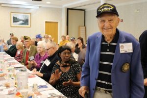Henry Silvestri, a U.S Merchant Marine, stands proudly as his name is called at last year’s veteran recognition ceremony at the Beltrone Living Center on November 9, 2015.